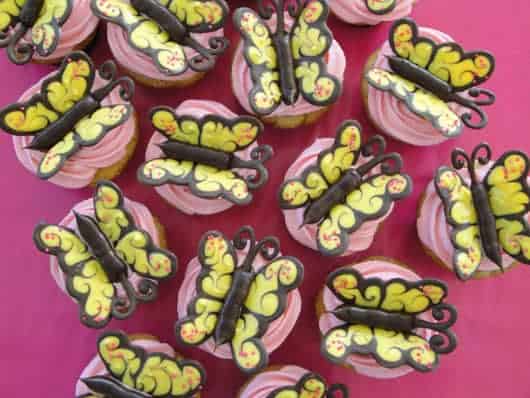 strawberries topped with chocolate butterflies