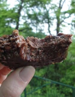 a bite taken out of a chocolate rice krispy bar