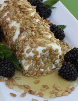 goat cheese with honey, sunflower seeds, and blackberries