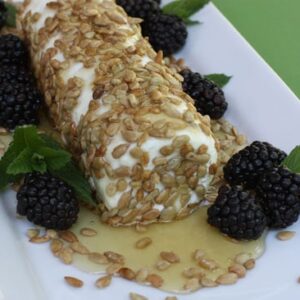 goat cheese with honey, sunflower seeds, and blackberries