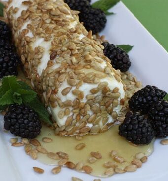 goat cheese with honey, sunflower seeds, and blackberries