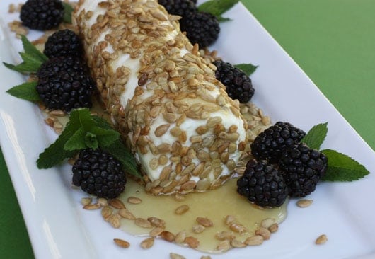 goat cheese with honey, sunflower seeds, and blackberries