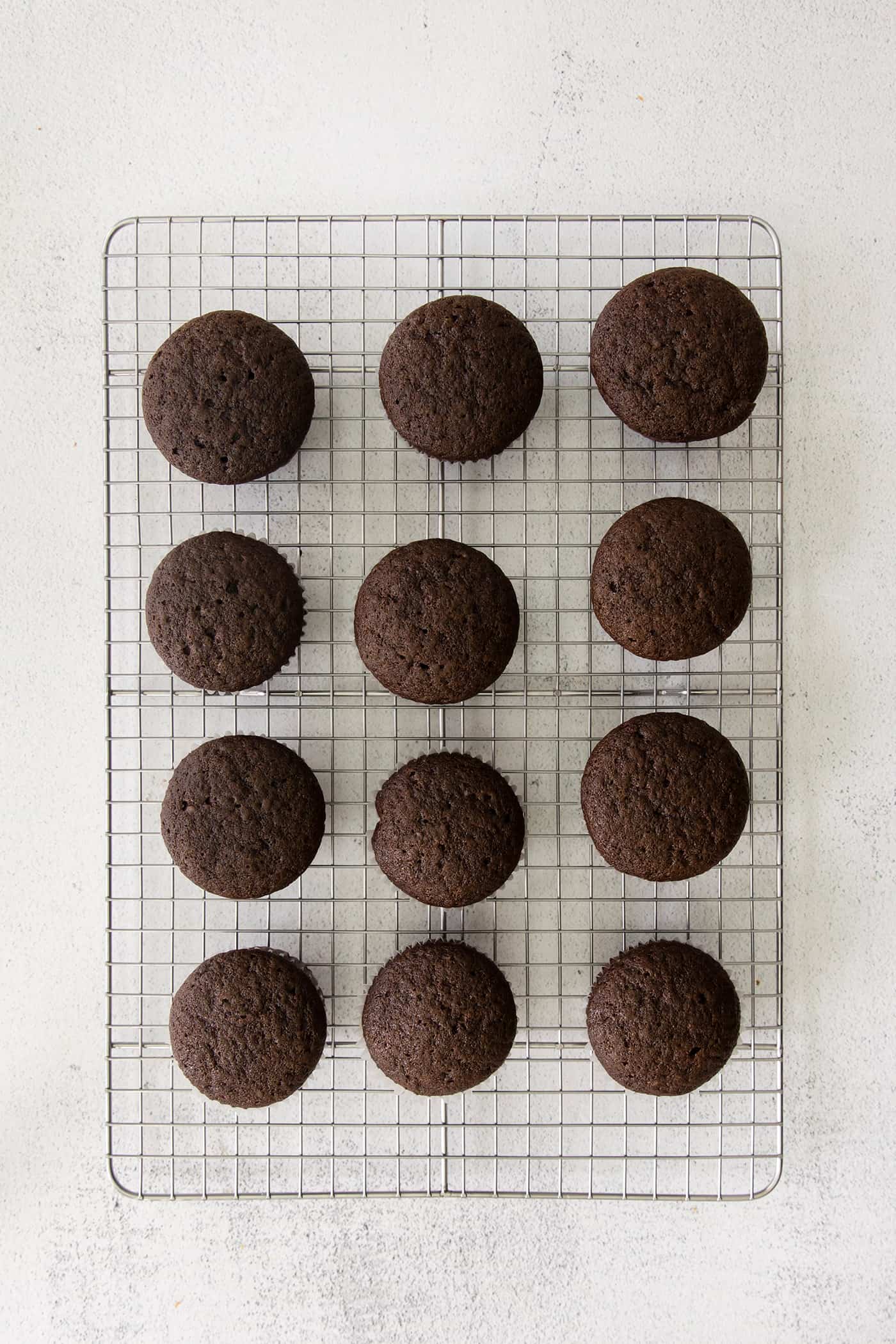 Chocolate cupcakes on a wire rack