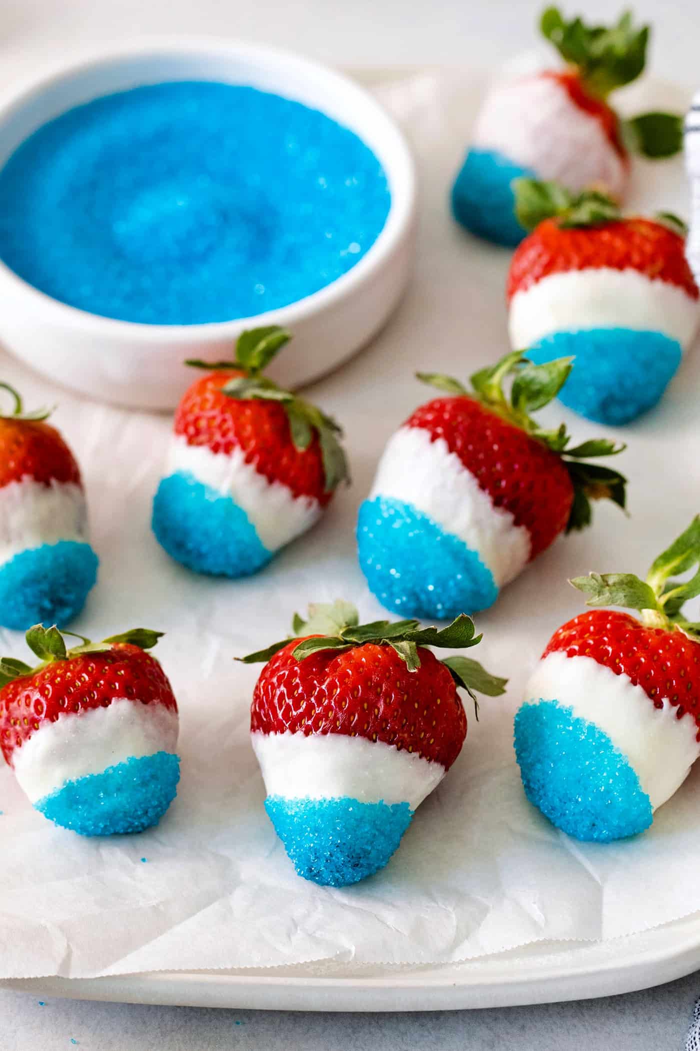 Angled overhead view of red white and blue chocolate covered strawberries