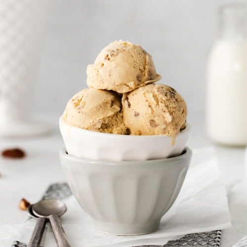 Butter pecan ice cream in a white dish