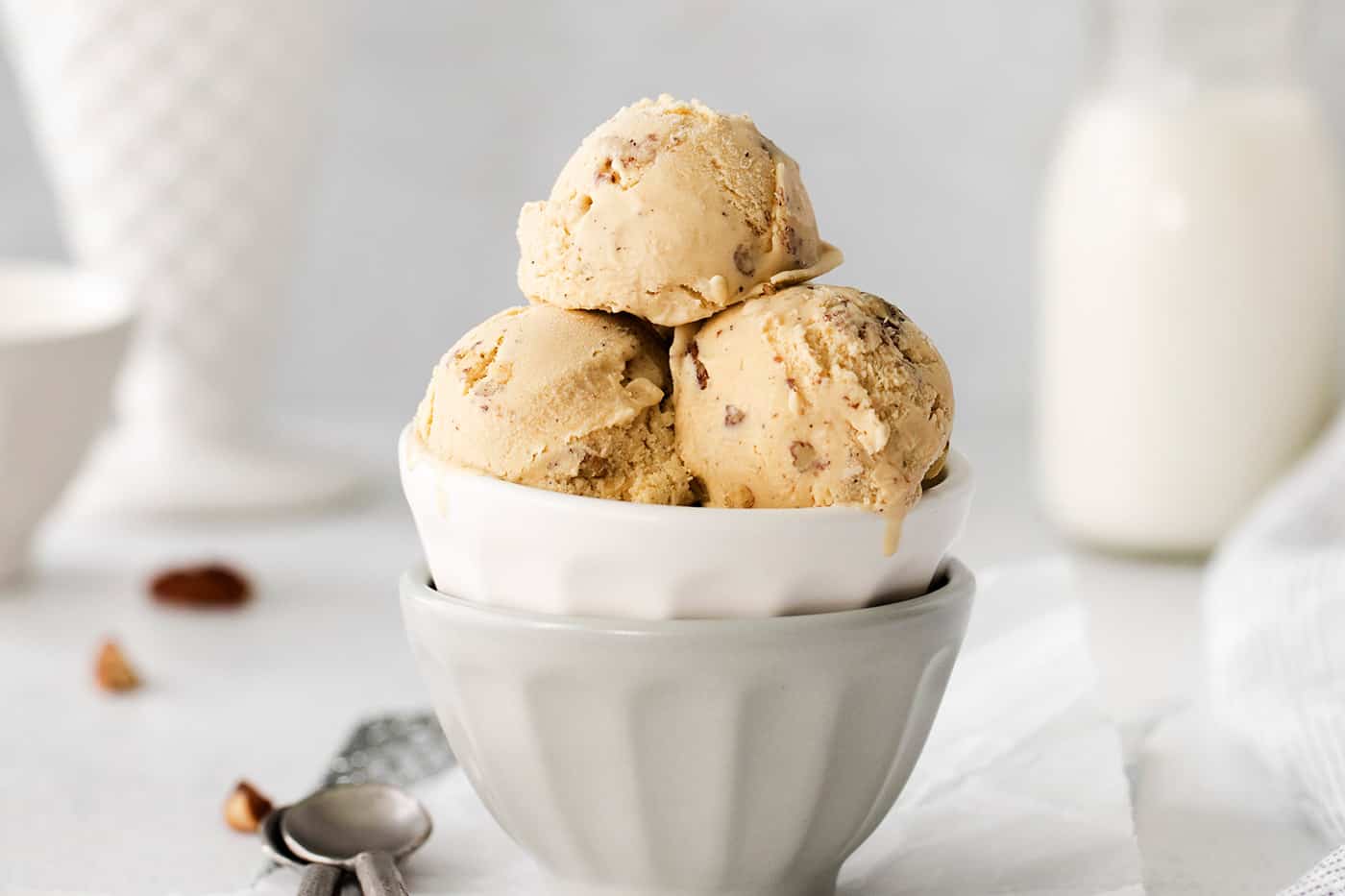 Scoops of butter pecan ice cream in a dish