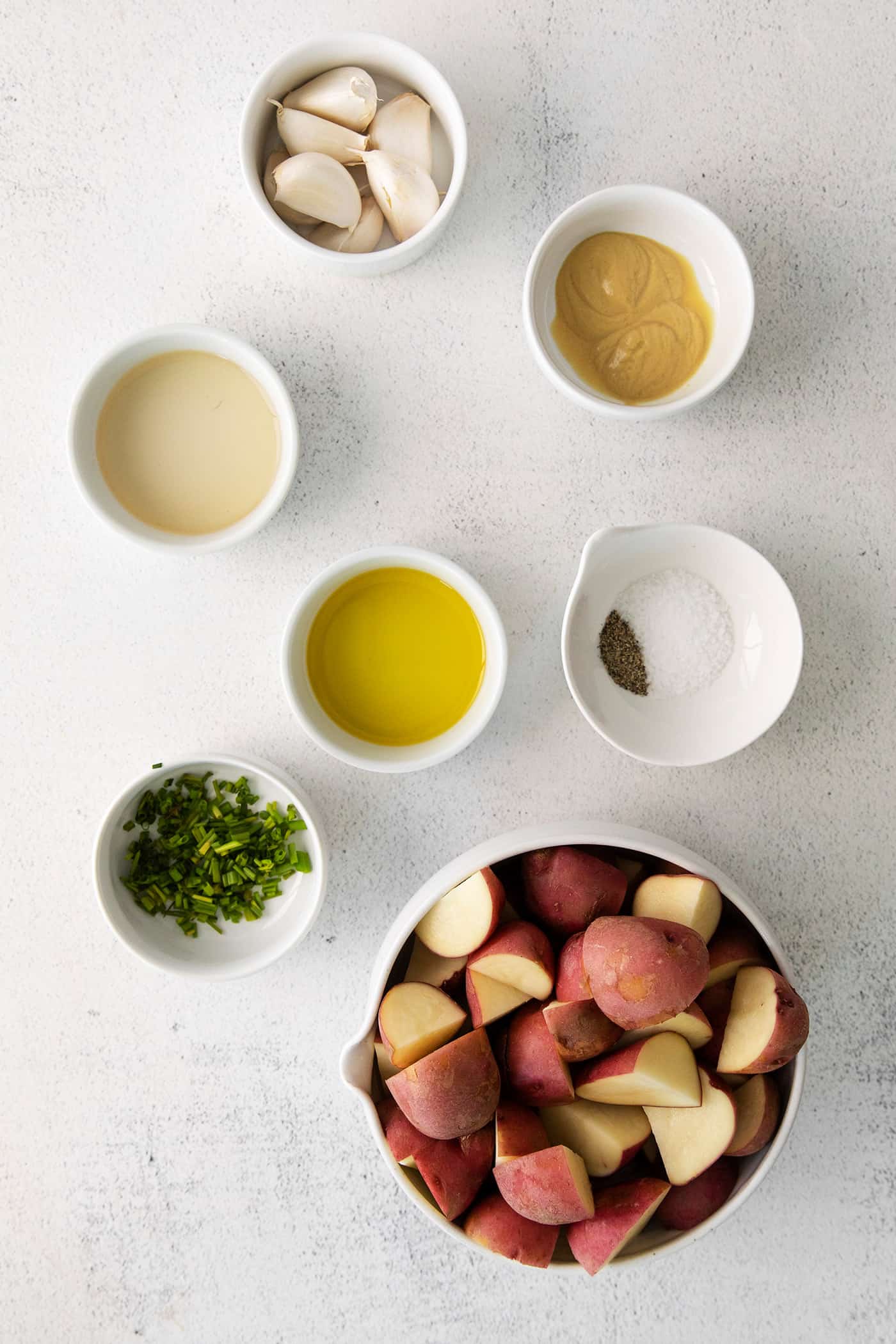 Ingredients to make potatoes with roasted garlic vinaigrette