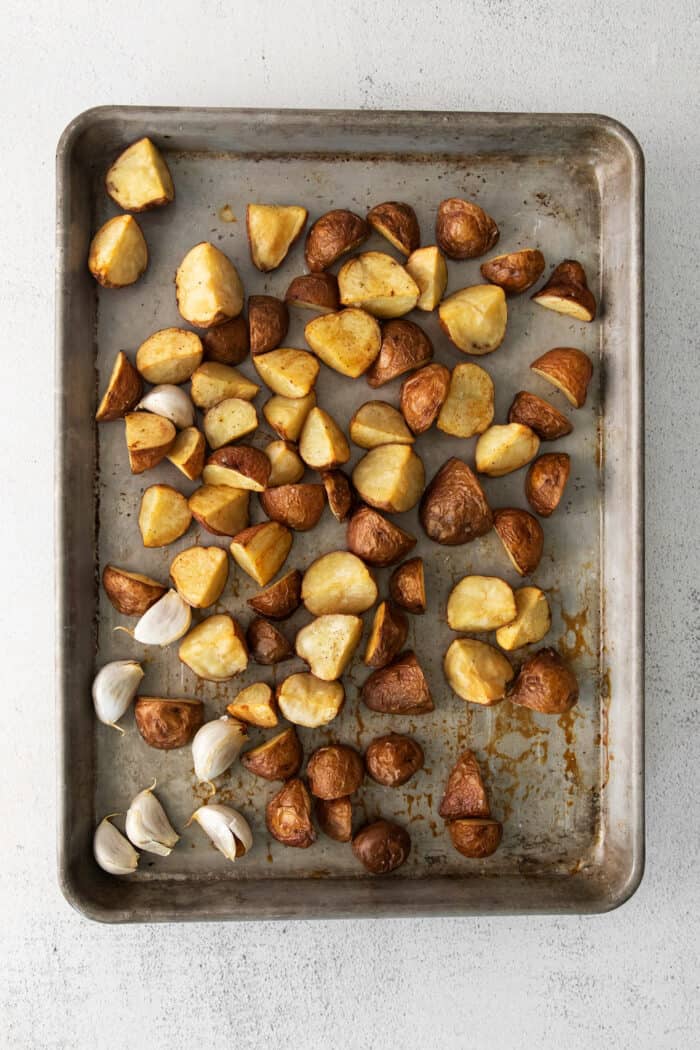 Roasted baby potatoes on a baking sheet