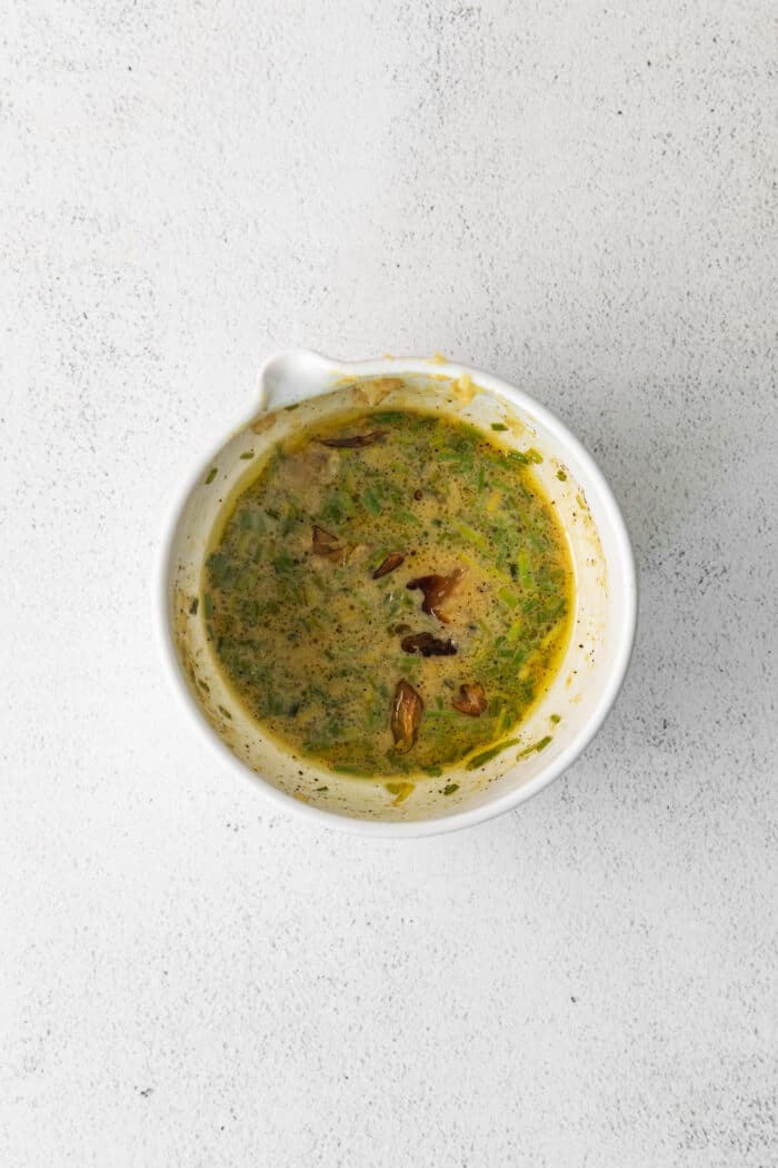 Roasted garlic and mustard vinaigrette on a baking sheet