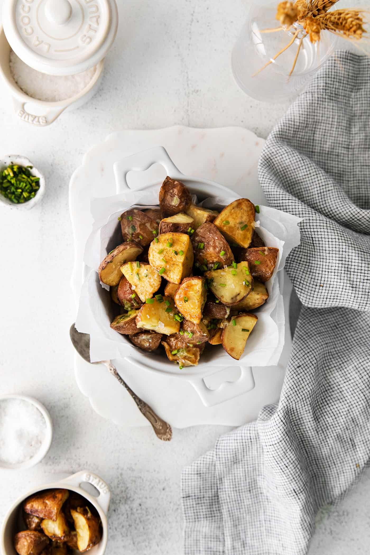 Oven roasted potatoes with garlic vinaigrette in a bowl