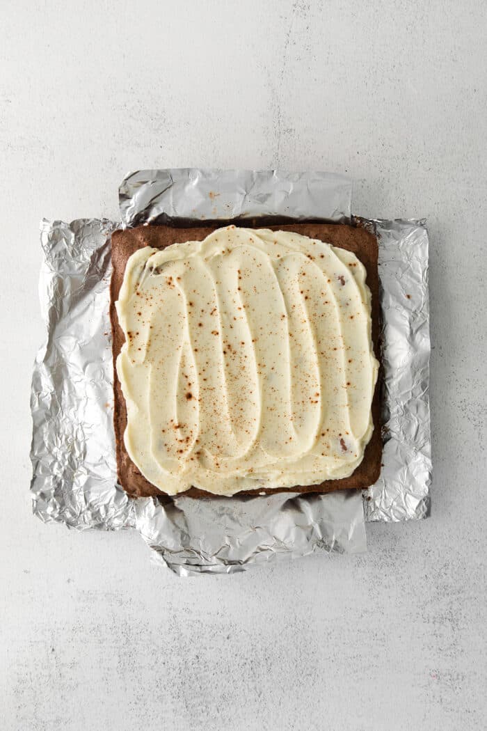 White chocolate ganache spread on espresso brownies