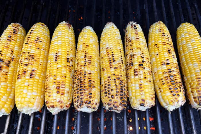 Charred corn cobs on the grill