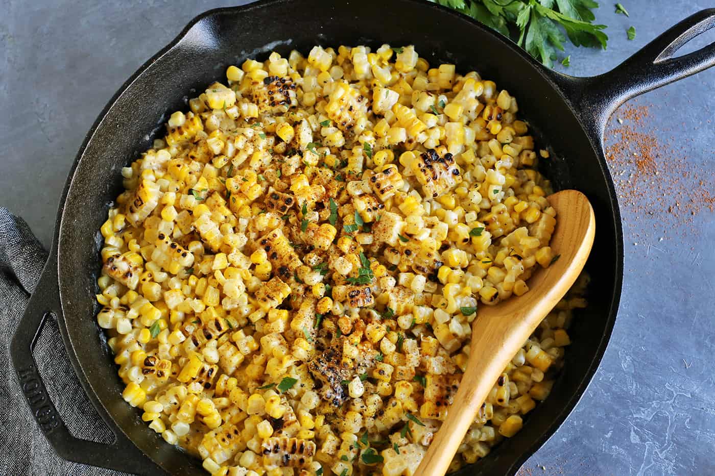 Grilled creamed corn in a cast iron skillet