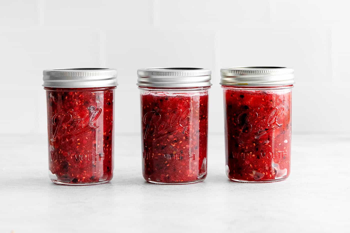 Three jars of raspberry blackberry freezer jam