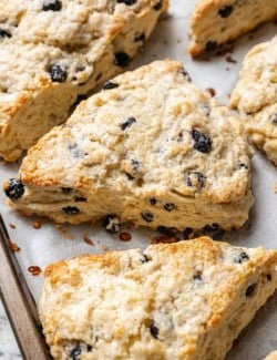 Closeup of blueberry scones on baking sheet