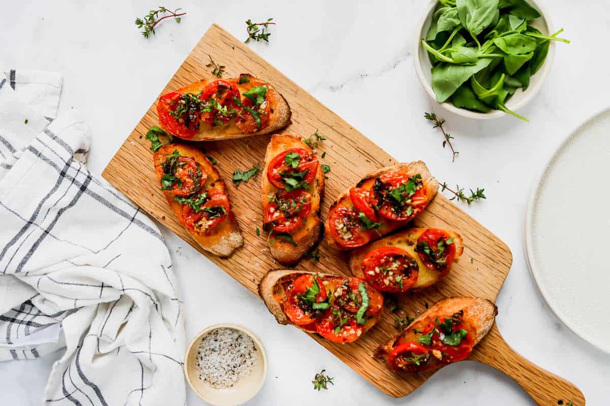 Oven roasted tomatoes on slices of a baguette