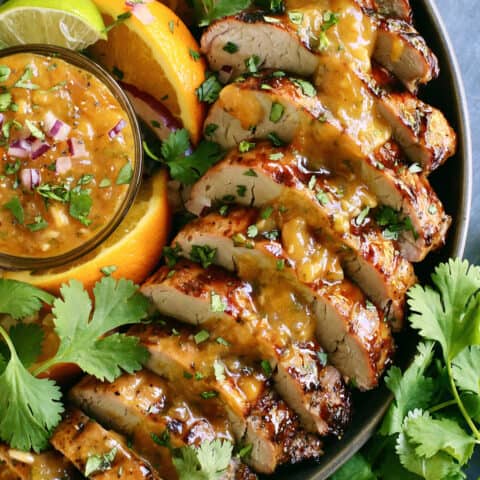 Overhead view of slices of grilled pork tenderloin