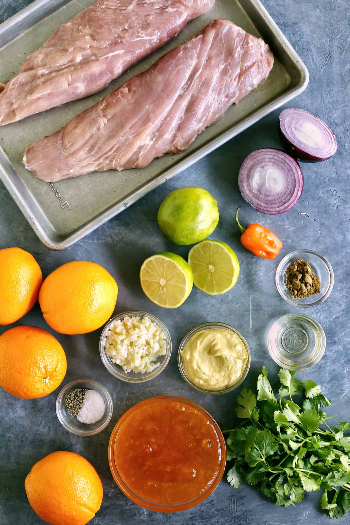 Overhead view of peach grilled pork tenderloin ingredients