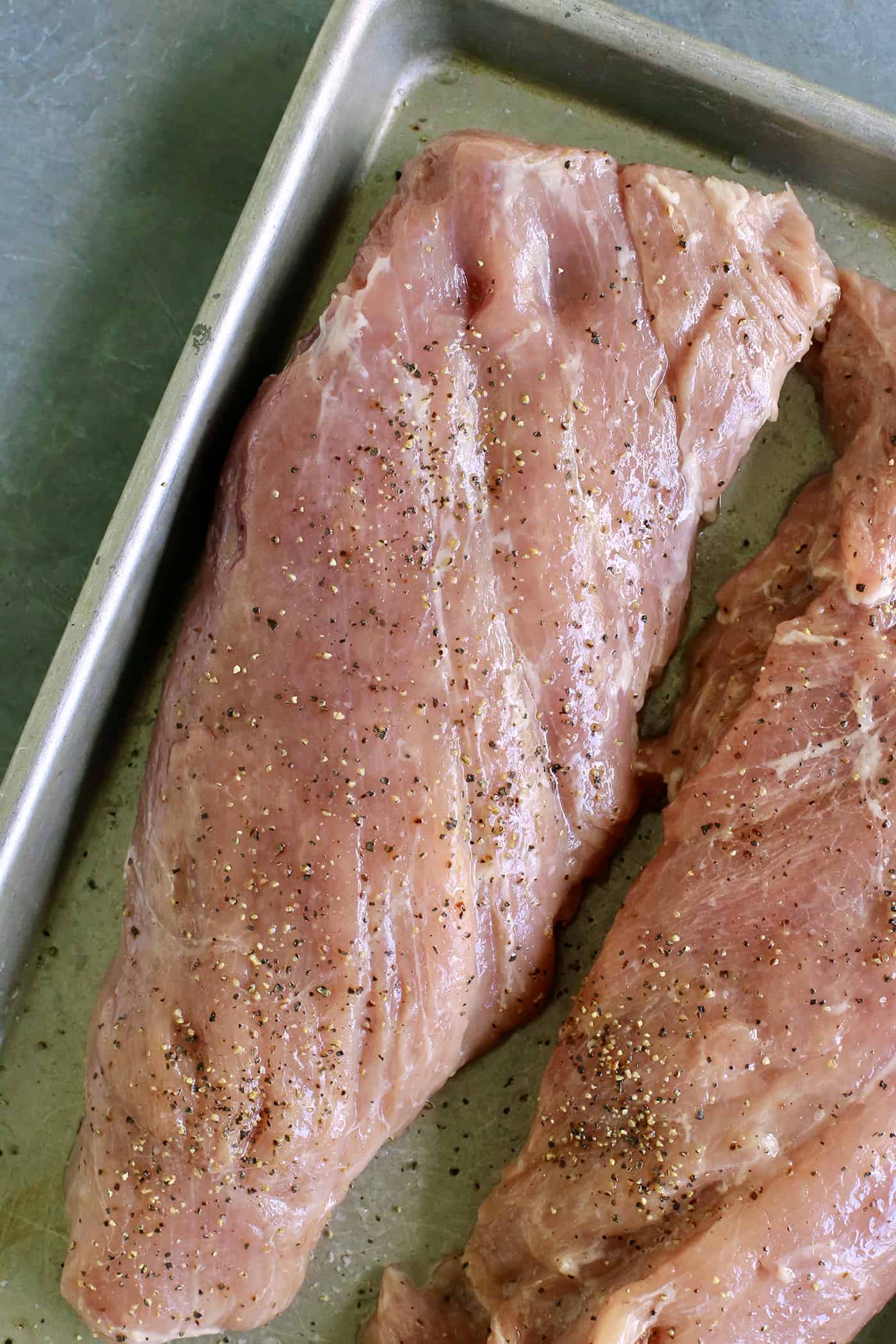 Pork tenderloin on a baking sheet