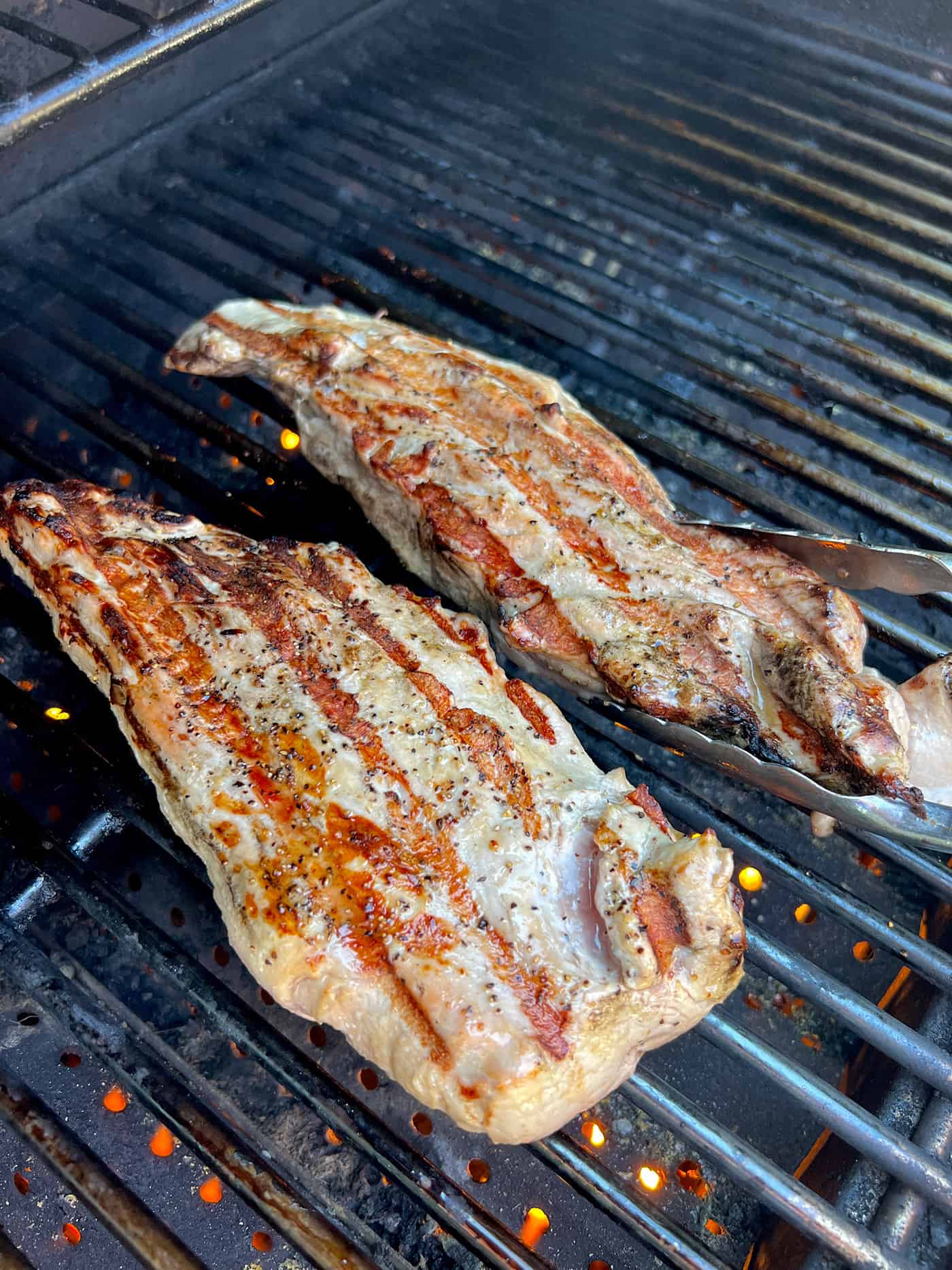 Seared pork tenderloins on the grill