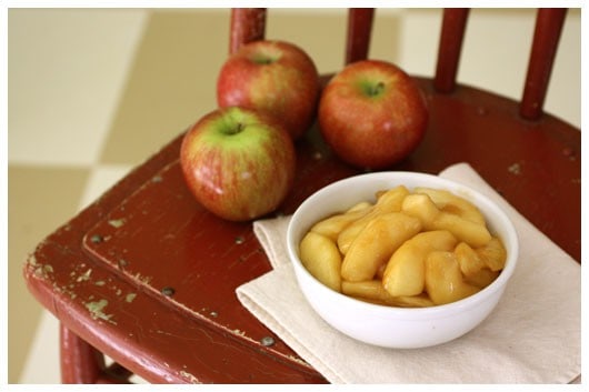 a white bowl of sautéed apples