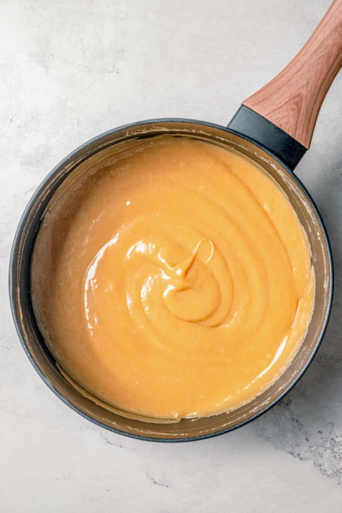 Overhead view of caramel apple dip in saucepan