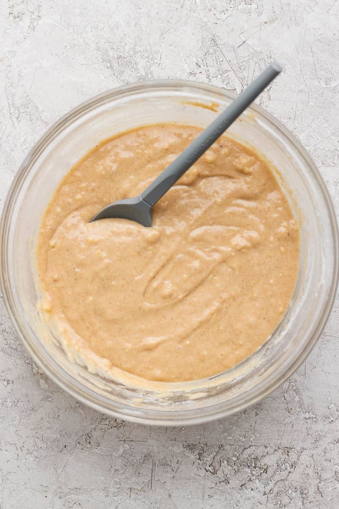 Cinnamon sugar doughnut muffins are easy to make and impossible to resist, with a moist, tender crumb and lots of cozy flavor. Perfection! Overhead view of batter for cinnamon sugar doughnut muffins in bowl with spoon