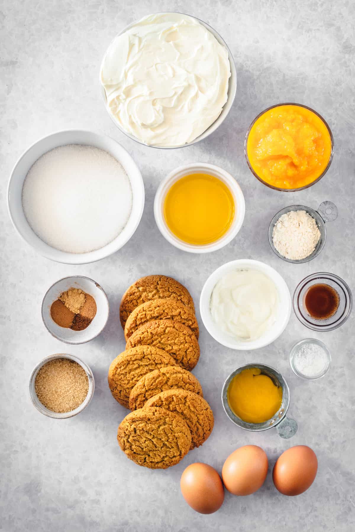 Overhead view of pumpkin cheesecake ingredients