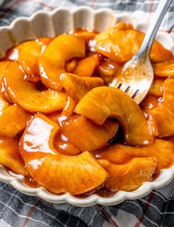 Fork in bowl of sautéed apples