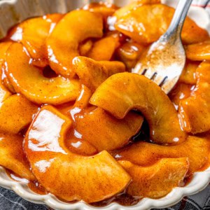 Fork in bowl of sautéed apples