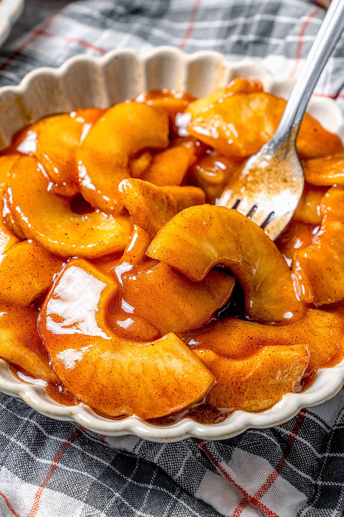 Fork in bowl of sautéed apples