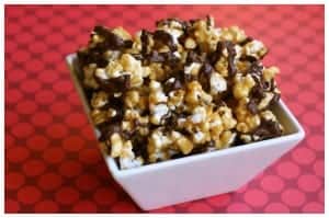 caramel corn with chocolate drizzle in a white dish