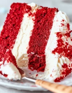 Closeup of red velvet cake slice on plate