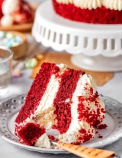 Red velvet cake slice on plate with fork