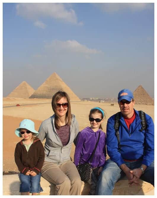 a family photo in front of the pyramids in egypt