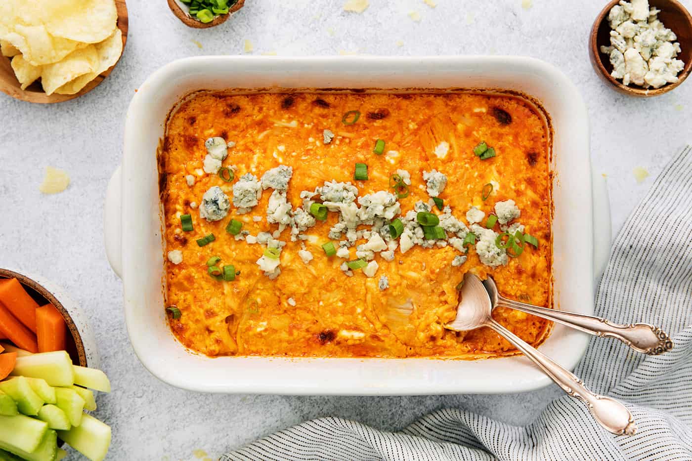 Overhead view of a casserole dish of baked buffalo chicken dip