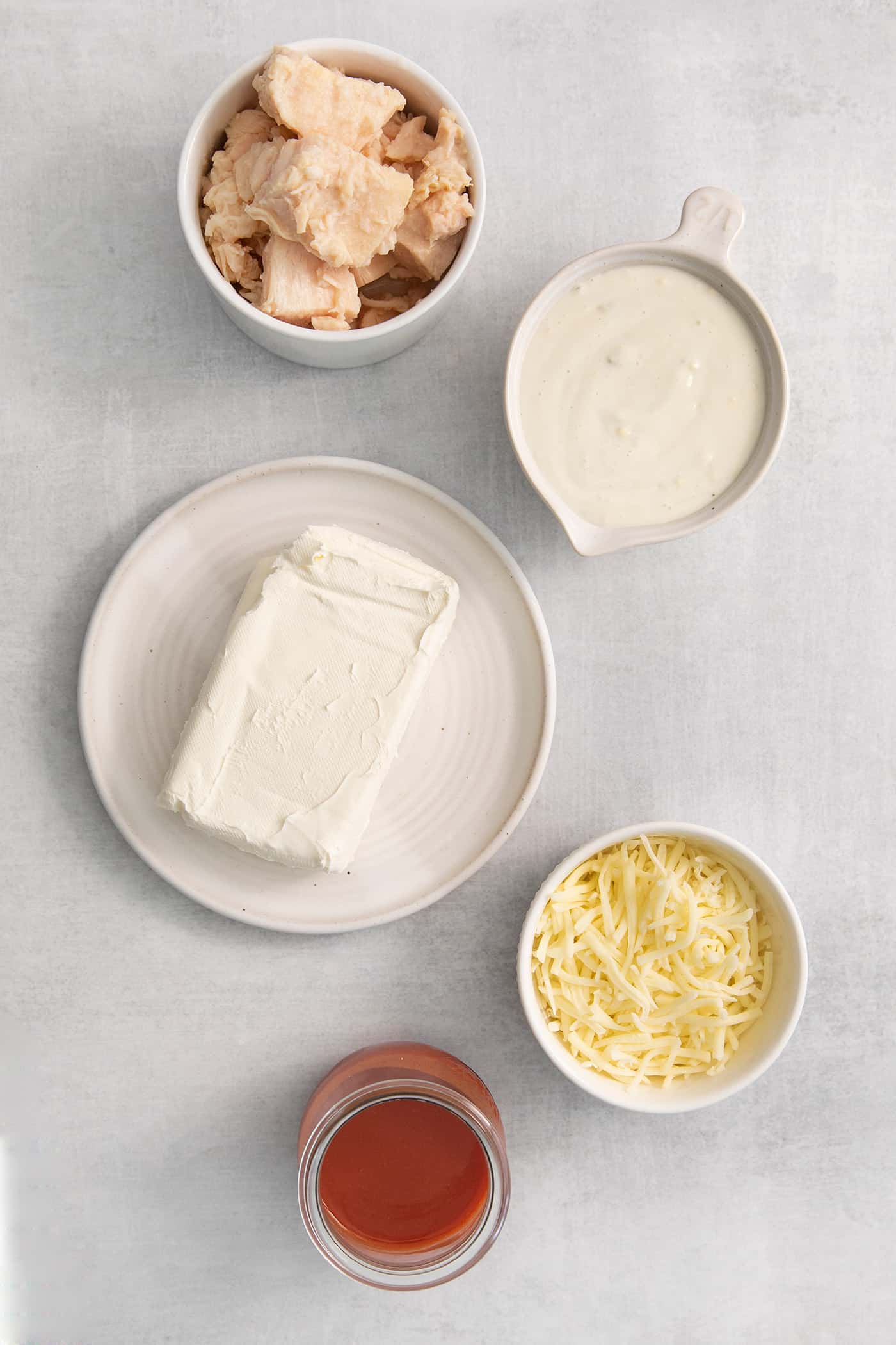 Overhead view of buffalo chicken dip ingredients