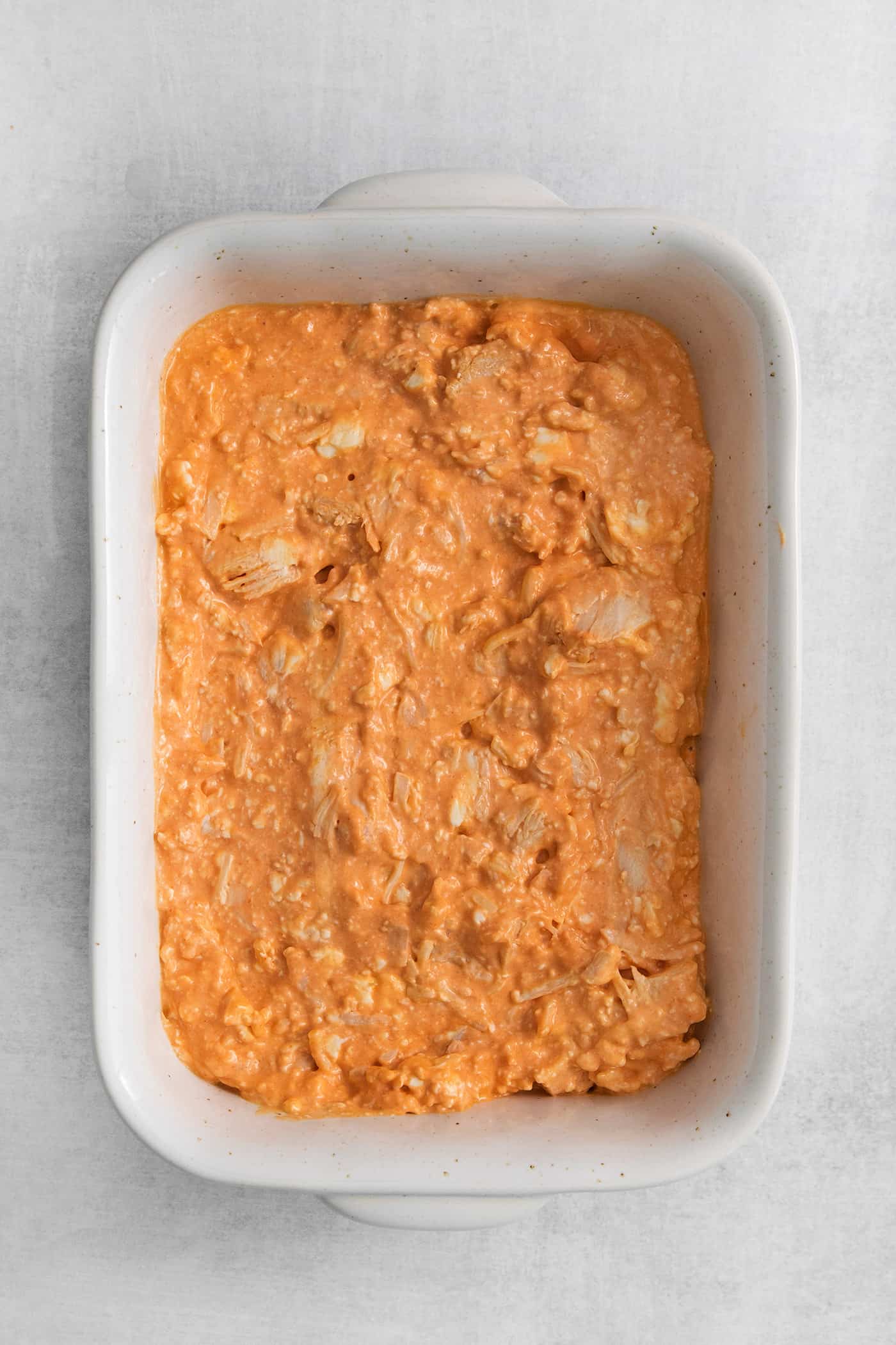 Buffalo chicken dip spread in a casserole dish