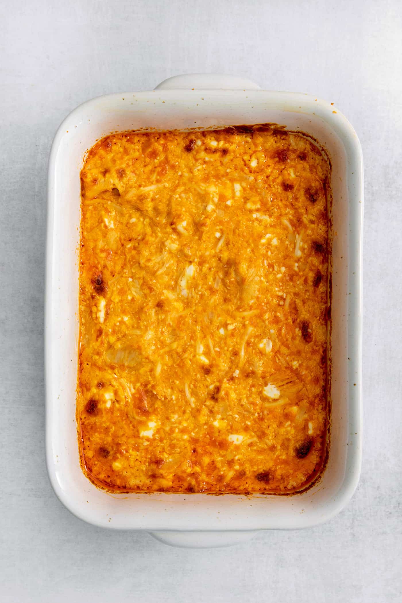 Overhead view of a casserole dish of buffalo chicken dip