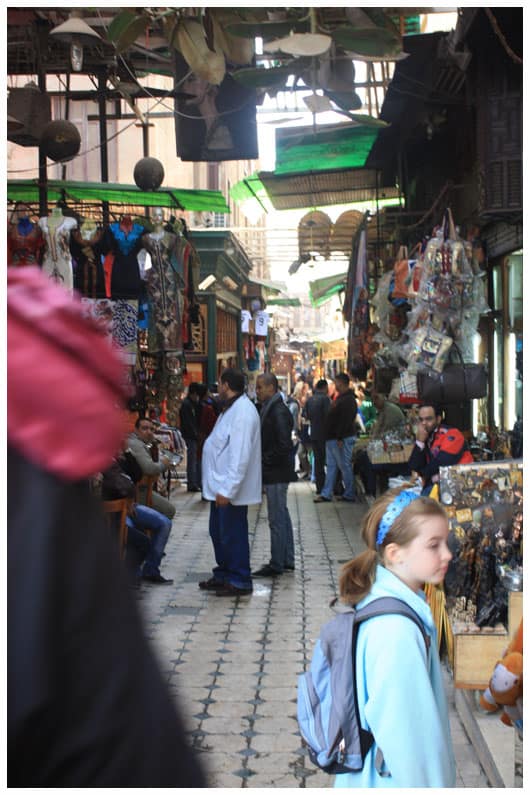 a girl standing in the market