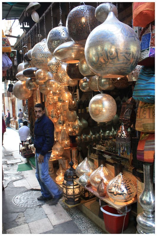 a stand selling metal lamps