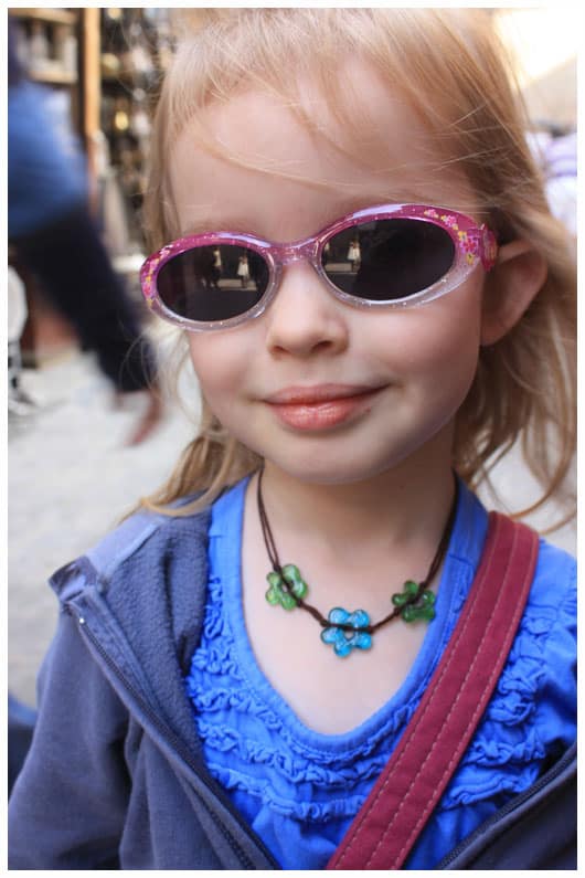 a girl wearing a necklace