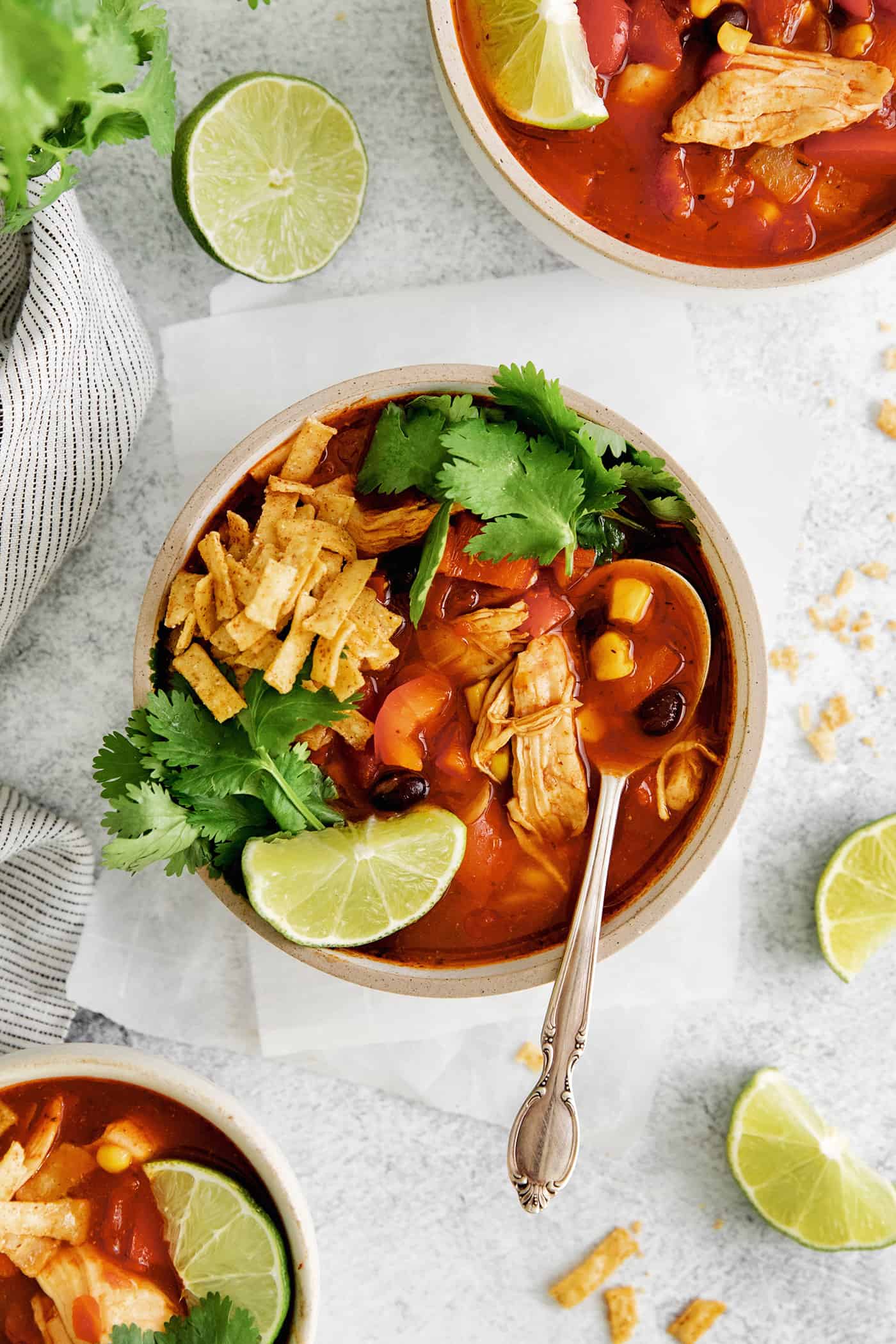 Overhead view of a bowl of chicken tortilla soup