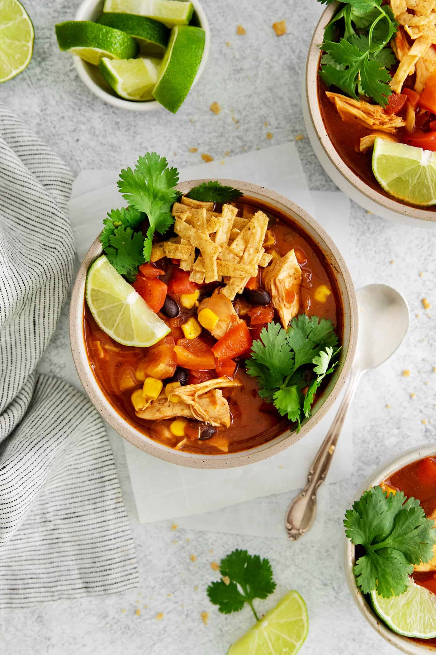 Overhead view of a bowl of chicken tortilla soup