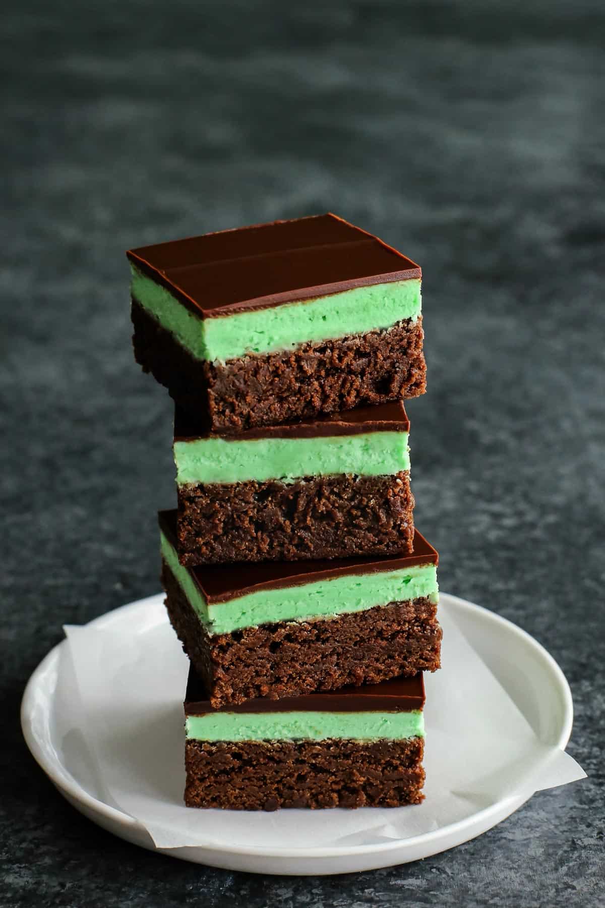 a stack of mint brownies on a plate