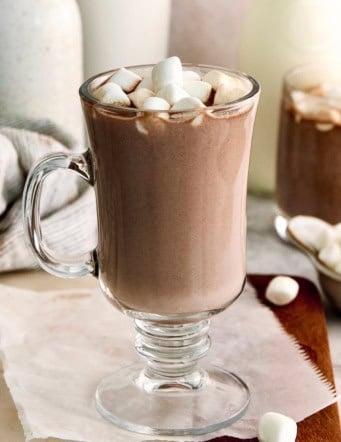 Homemade hot chocolate in glass mug with marshmallows