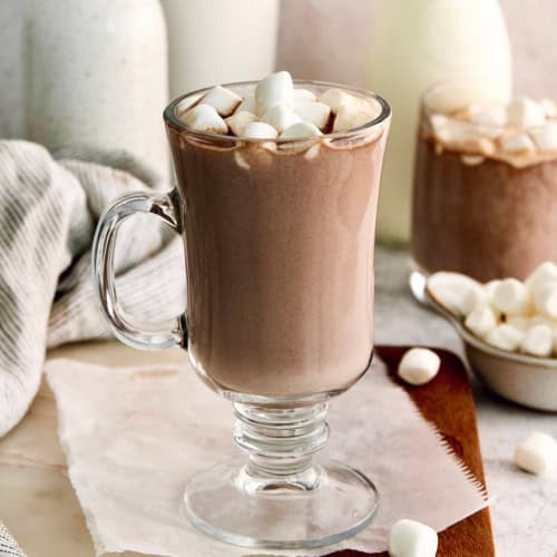 Homemade hot chocolate in glass mug with marshmallows