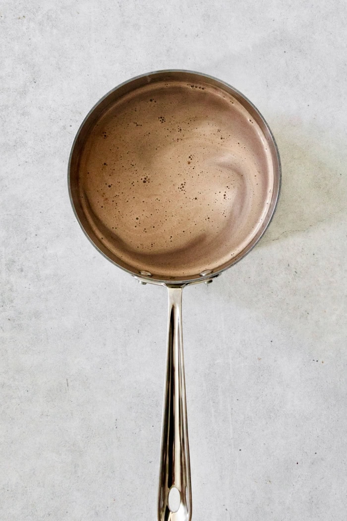 Overhead view of hot chocolate in pan