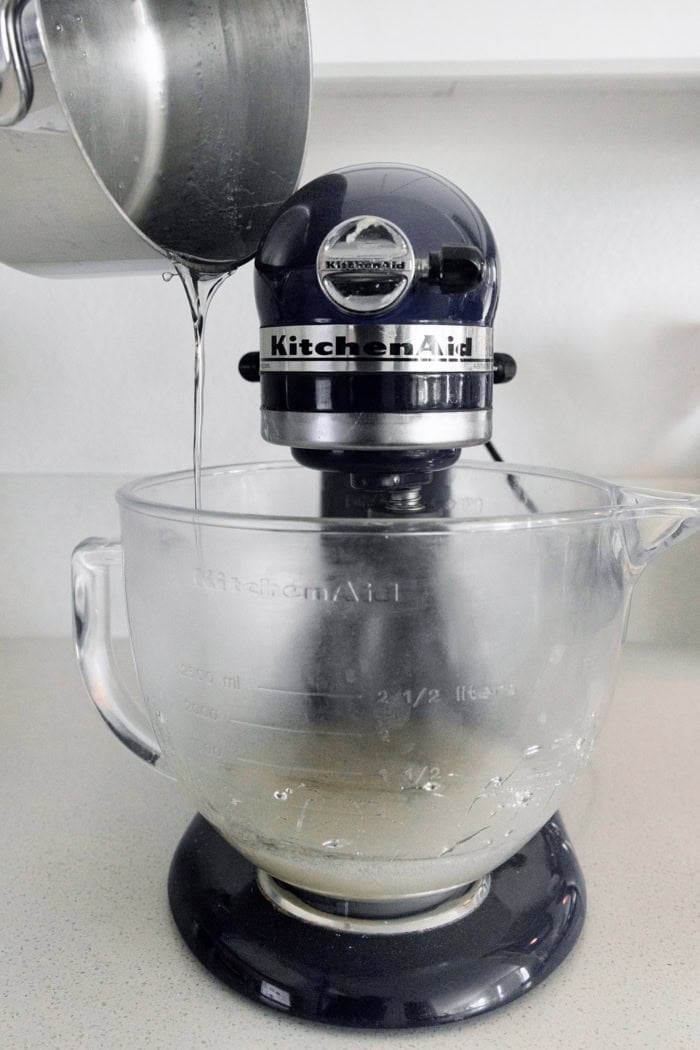 Pouring syrup into bowl of stand mixer