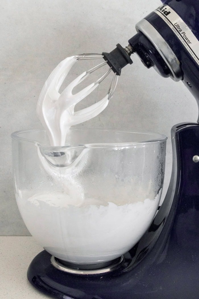 Marshmallow mixture in bowl of stand mixer fitted with whisk attachment